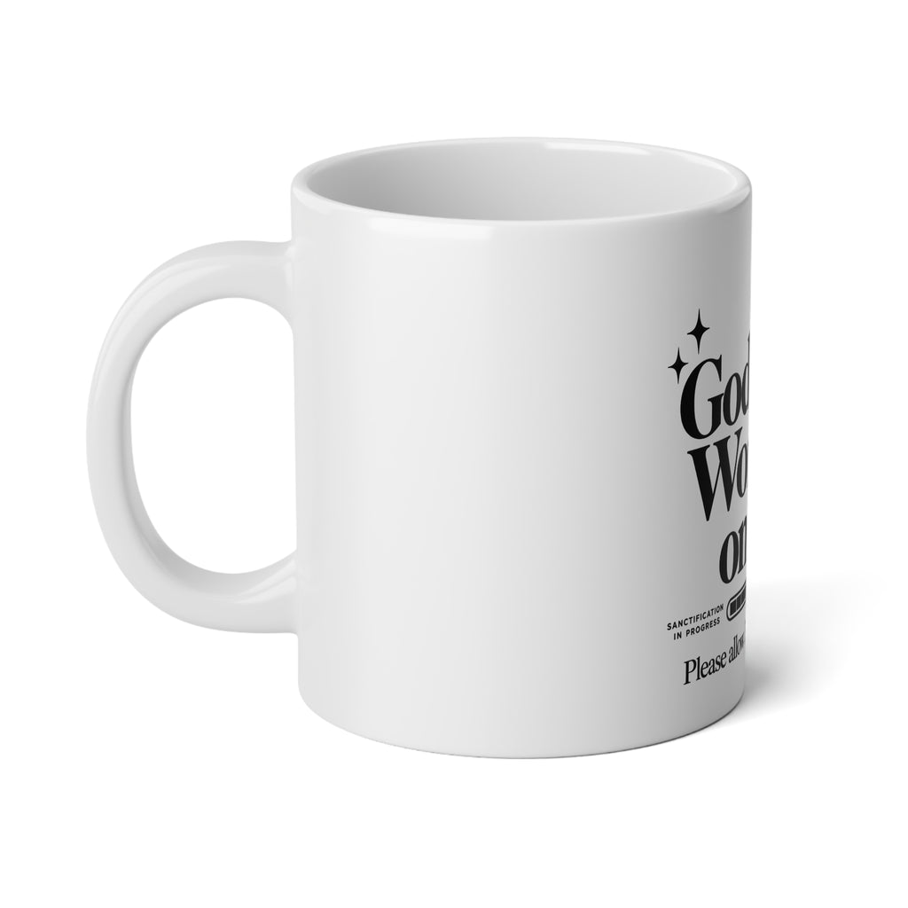 God's Still Working on Me Mug