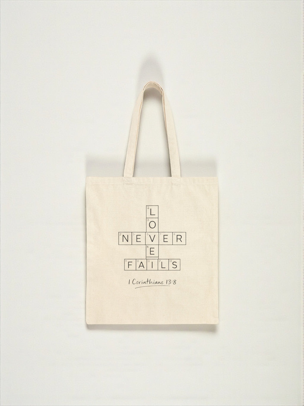 Love Never Fails Tote Bag